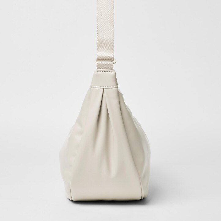 yellow uniqlo round shoulder bag womens bags